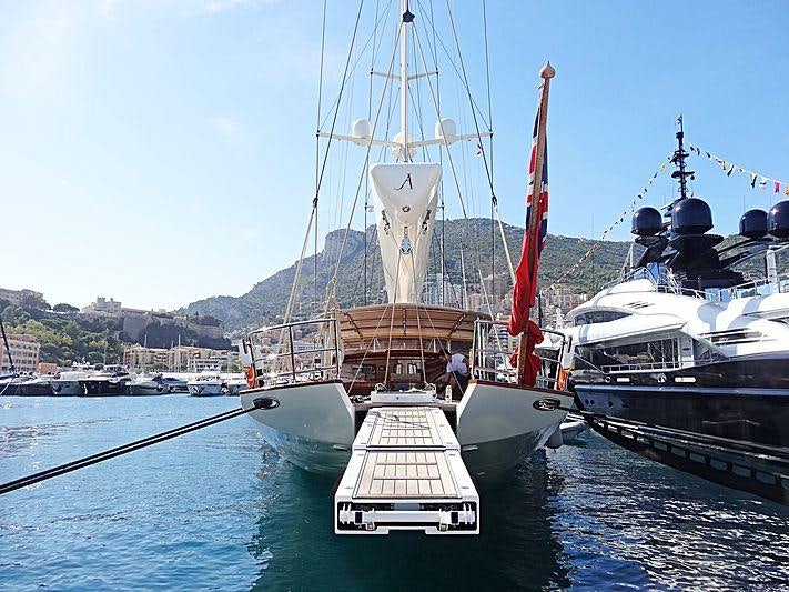 a boat docked at a pier aboard ATHOS Yacht for Charter