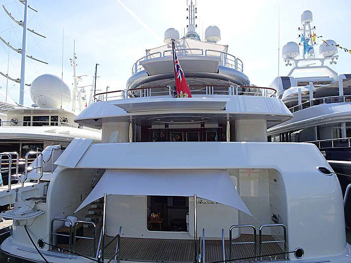 a large white boat with flags aboard CALYPSO Yacht for Charter