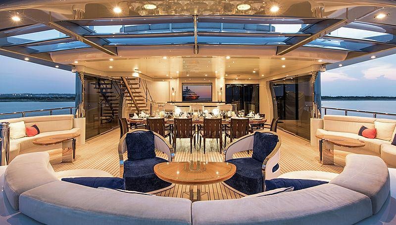 a large room with a table and chairs aboard ARIENCE Yacht for Charter