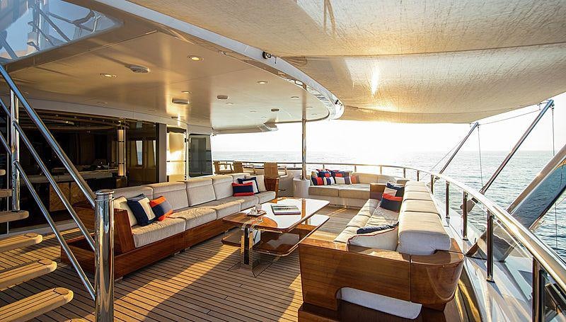 a large living room with a balcony aboard ARIENCE Yacht for Charter