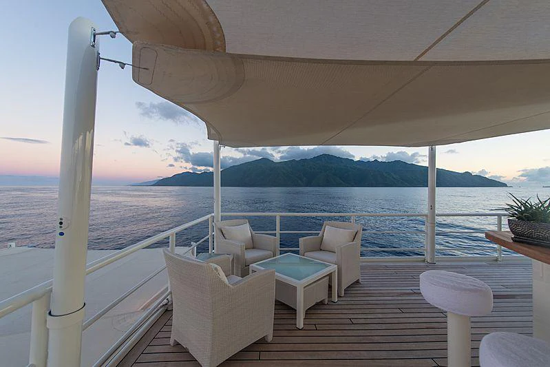 a deck with chairs and tables on it aboard SEAWOLF Yacht for Charter