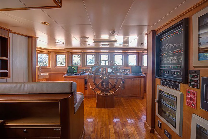 a room with a large fan and a table with chairs aboard SEAWOLF Yacht for Charter