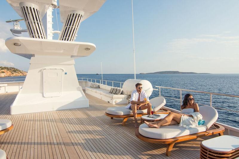 a group of people sitting on a boat on the water aboard O'NATALINA Yacht for Charter