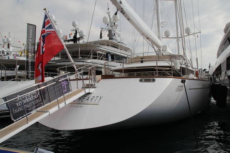 a large boat with a flag on it aboard ROSEHEARTY Yacht for Charter