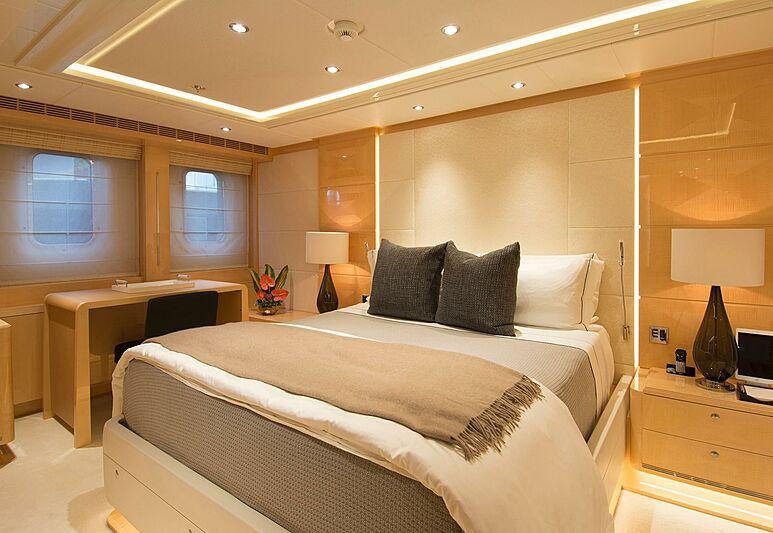 a bedroom with a large bed aboard SOUTH Yacht for Charter