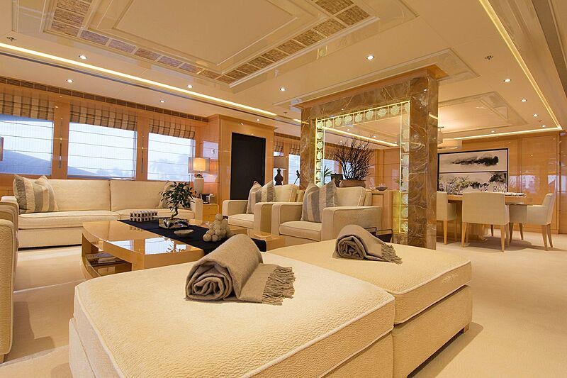 a living room with a large window aboard SOUTH Yacht for Charter