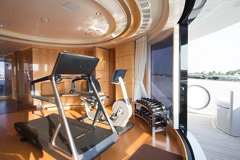 a treadmill in a room aboard SOUTH Yacht for Charter