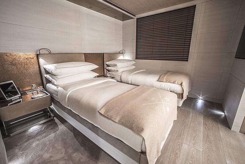 a room with a bed and a table aboard SEVERIN*S Yacht for Charter