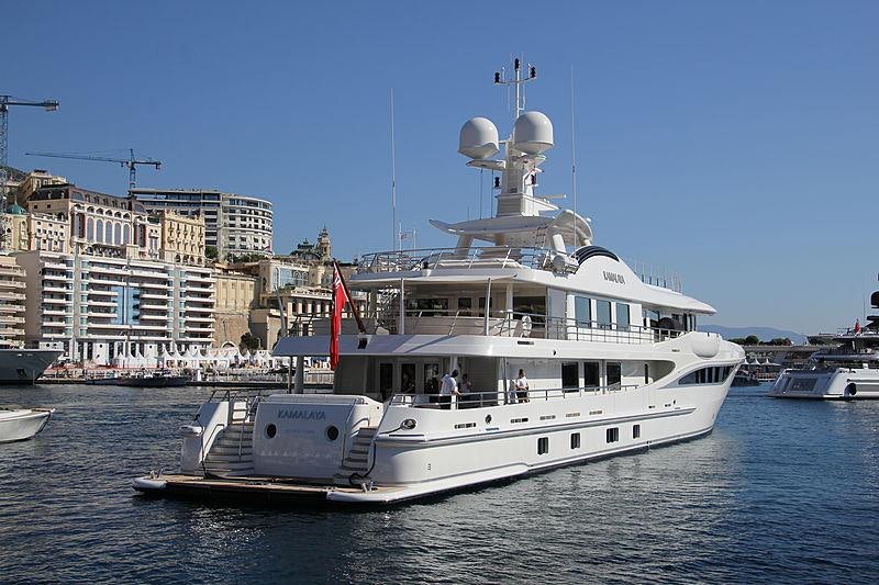 a large white boat in the water aboard KAMALAYA Yacht for Charter