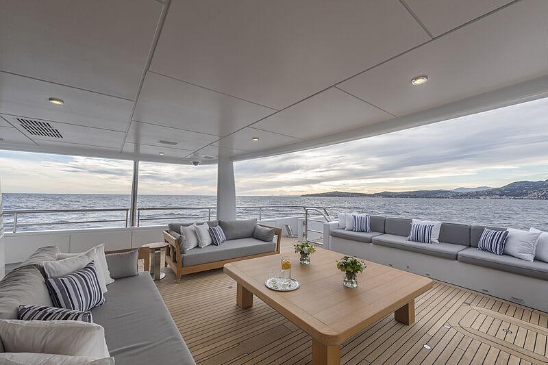 a living room with a couch and a table aboard SPIRIT Yacht for Charter