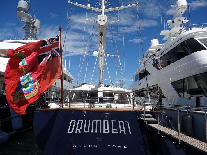 a large boat with a flag on it aboard DRUMBEAT Yacht for Charter