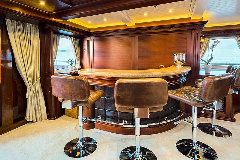 a room with a table and chairs aboard MIKHAIL S. VORONTSOV Yacht for Charter
