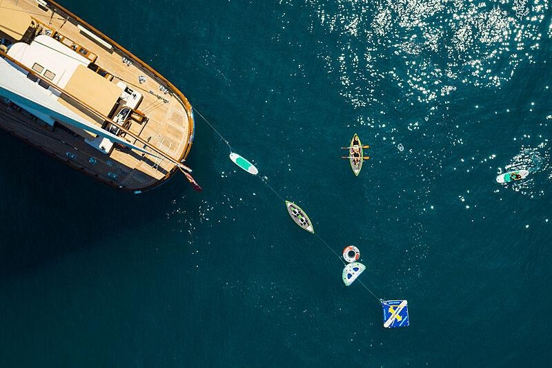 a group of people in a circle aboard MIKHAIL S. VORONTSOV Yacht for Charter
