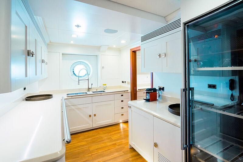 a kitchen with a glass door aboard MIKHAIL S. VORONTSOV Yacht for Charter