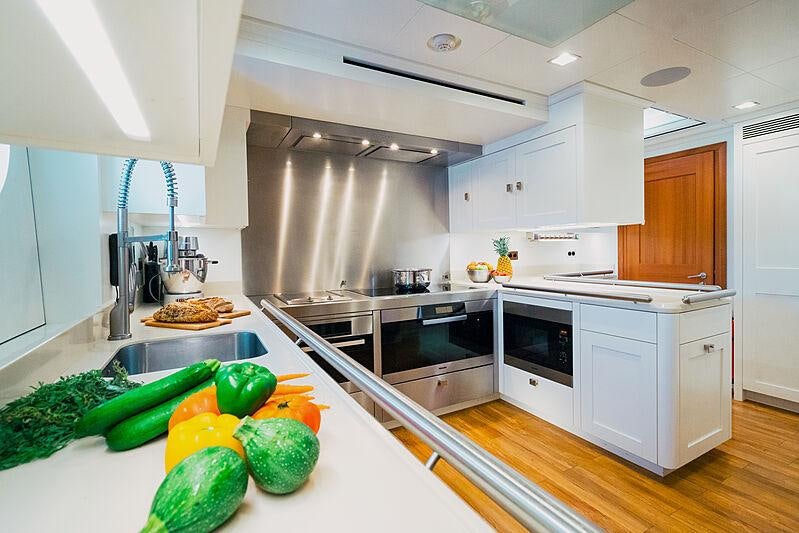 a kitchen with a large island aboard MIKHAIL S. VORONTSOV Yacht for Charter