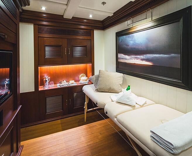 a living room with a tv aboard MIKHAIL S. VORONTSOV Yacht for Charter