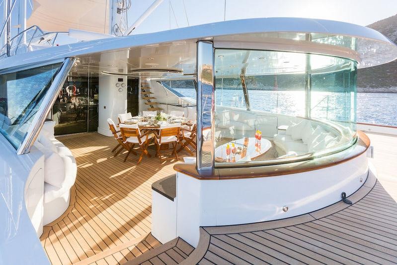 a boat on a deck aboard Q Yacht for Charter