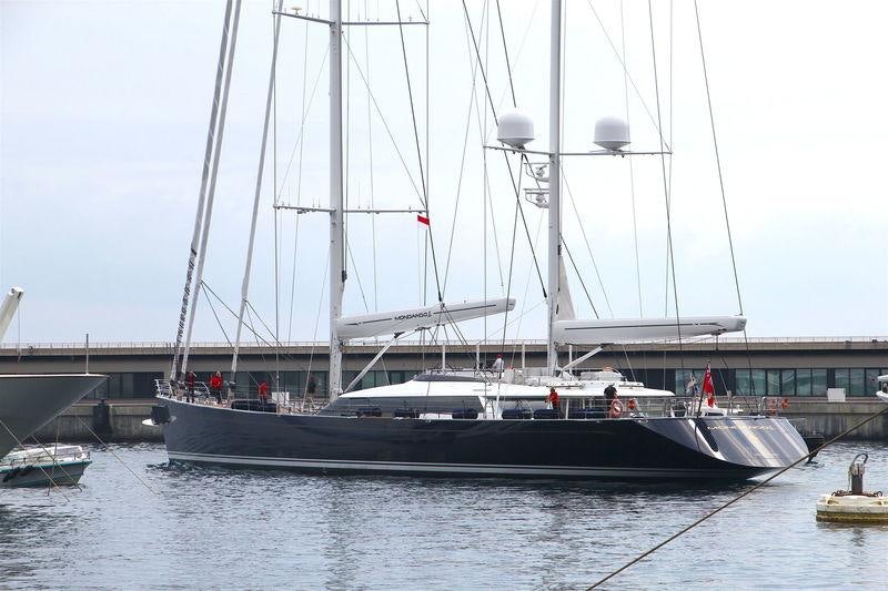 a boat docked at a pier aboard Q Yacht for Charter