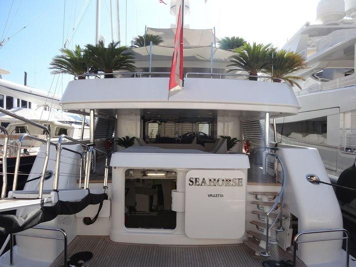 a boat with a flag on the front aboard SEAHORSE Yacht for Charter