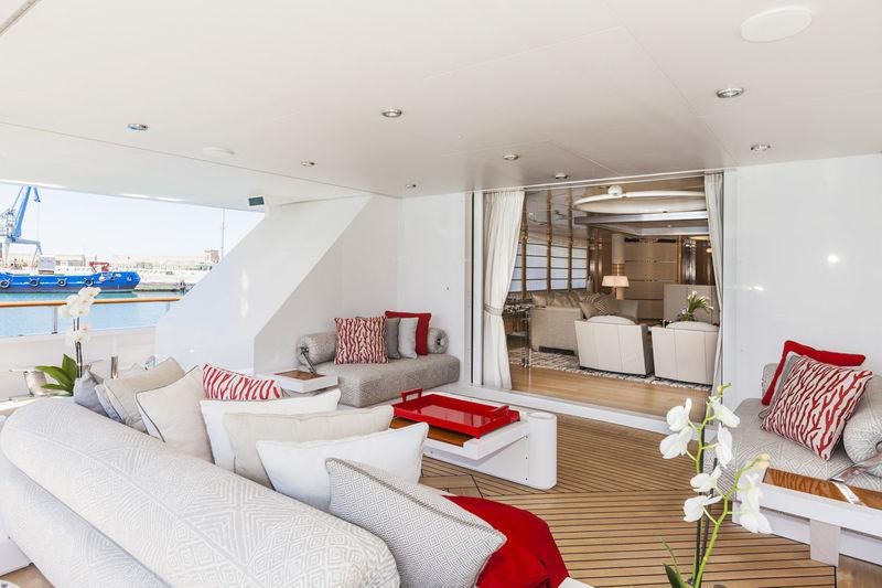 a living room with a large window aboard AMORE MIO 2 Yacht for Sale