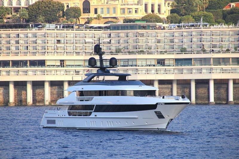 a large white boat in the water aboard SEVEN SINS Yacht for Charter