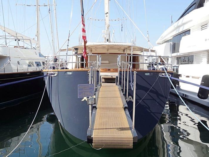a boat docked at a pier aboard XASTERIA Yacht for Charter