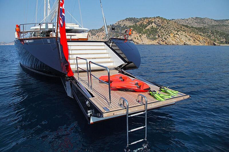 a boat with a red and white stripe on the front aboard PRANA Yacht for Charter