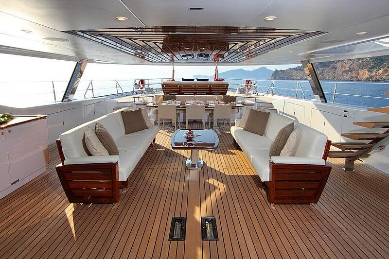 a room with a couch and a table aboard PRANA Yacht for Charter