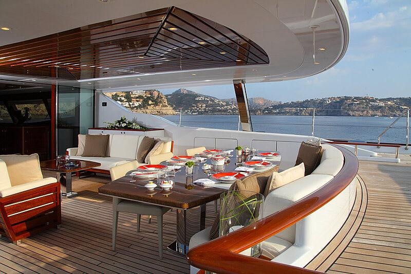 a room with a table and chairs aboard PRANA Yacht for Charter