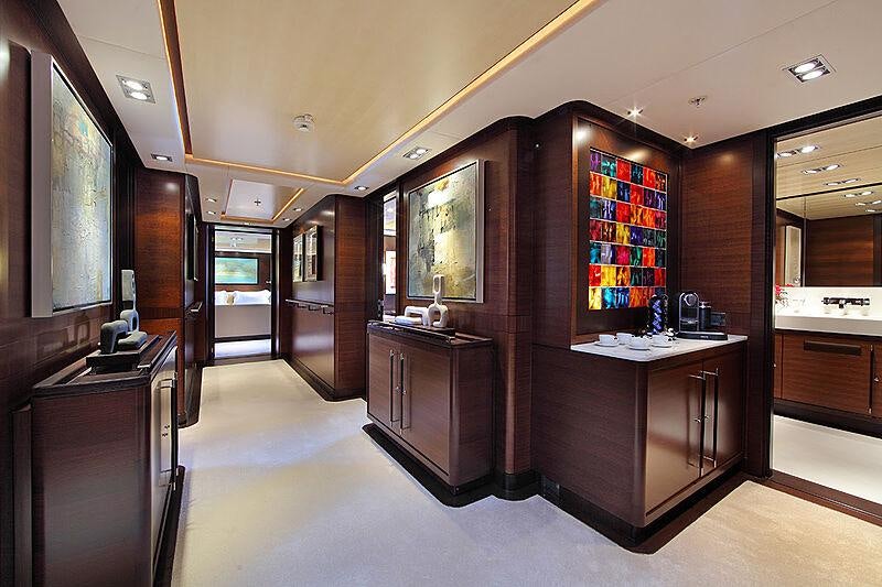 a room with a desk and a computer aboard PRANA Yacht for Charter