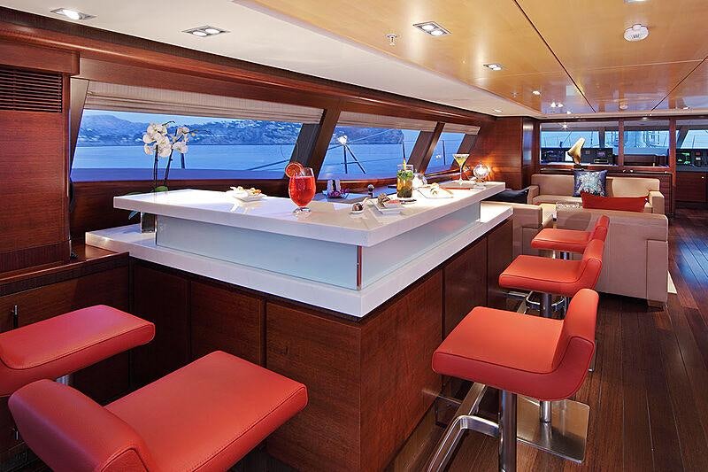 a room with a table and chairs aboard PRANA Yacht for Charter