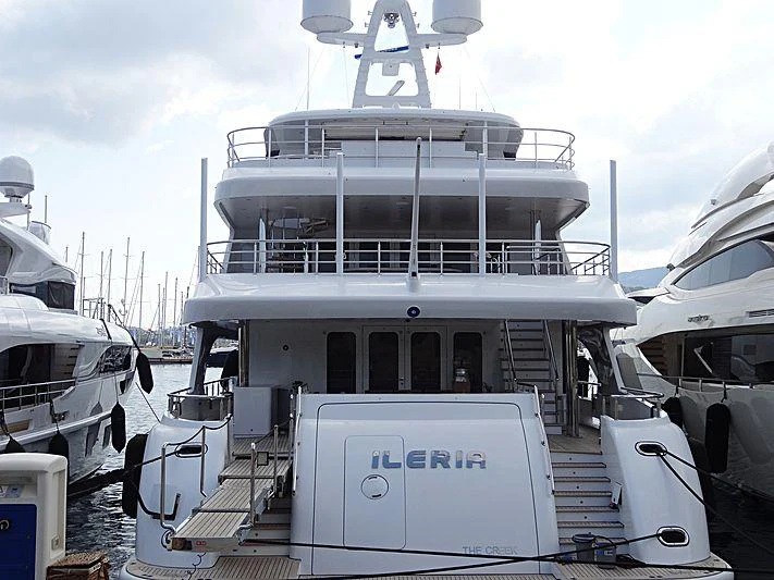 a large white boat with a large white ship on it aboard ILERIA Yacht for Charter