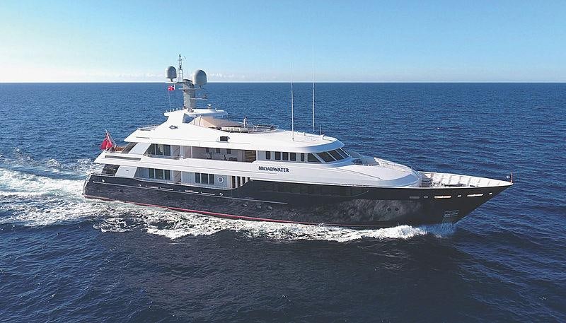 a large white boat in the water aboard REVERIE Yacht for Charter