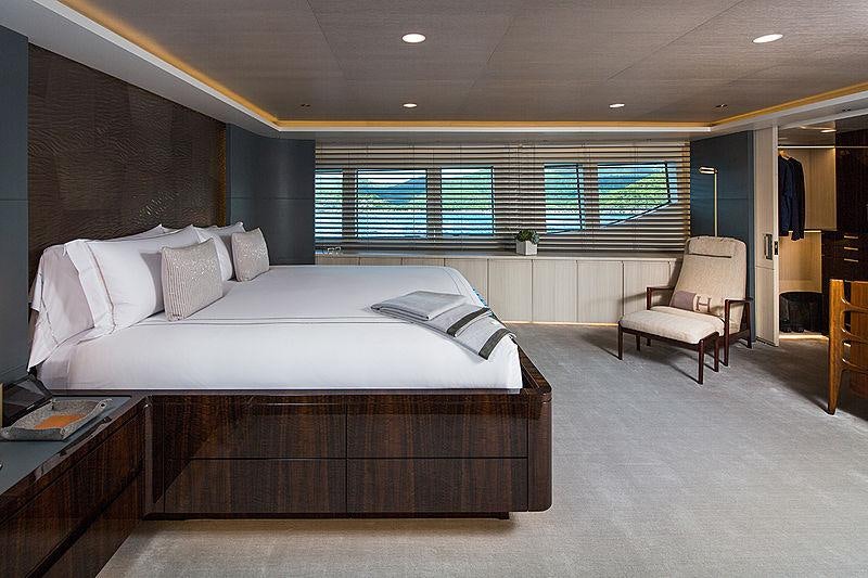 a large bedroom with a large bed aboard REVERIE Yacht for Charter