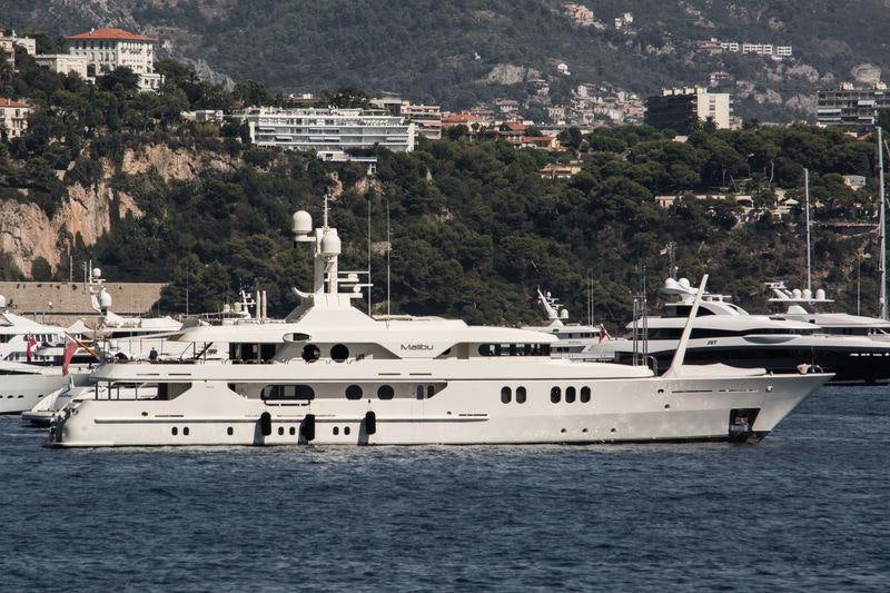 a large white boat in the water aboard MERCURY Yacht for Charter