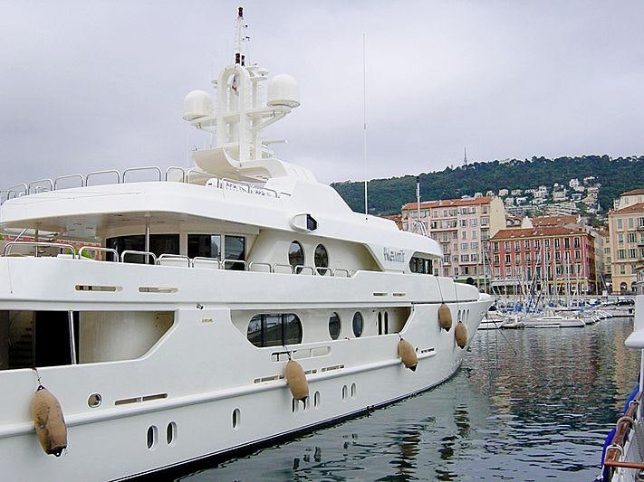 a white boat in a harbor aboard MERCURY Yacht for Charter
