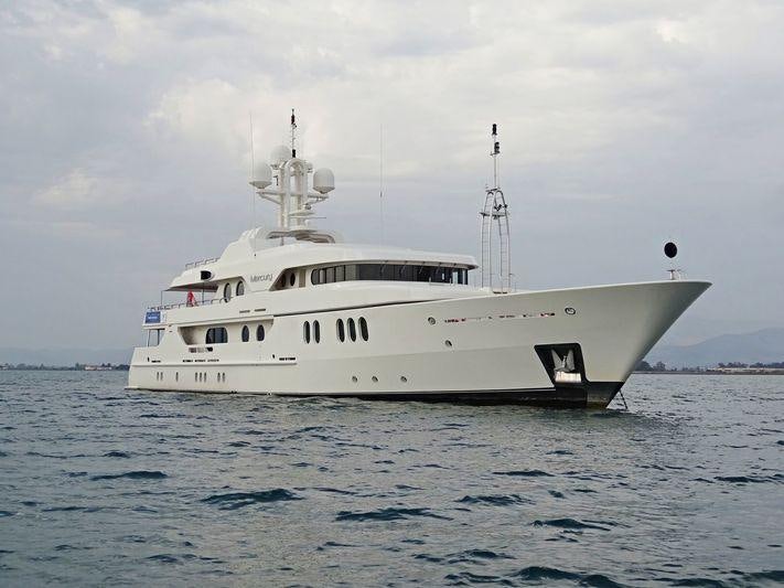 a white boat in the water aboard MERCURY Yacht for Charter