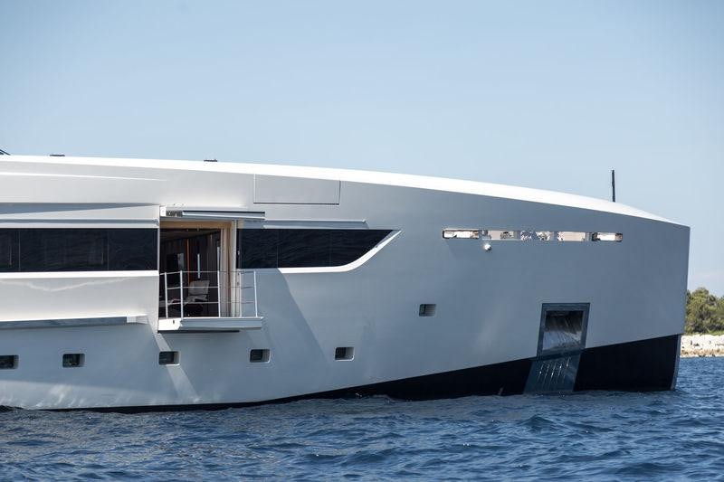 a large white building with a pool aboard VERTIGE Yacht for Charter