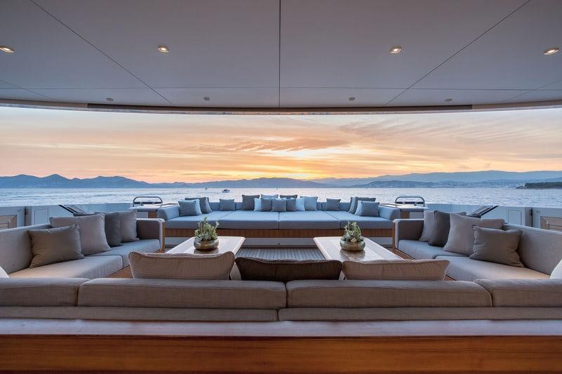 a room with a couch and a table aboard VERTIGE Yacht for Charter