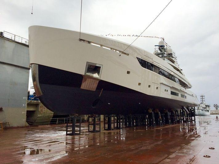 a large cruise ship docked aboard VERTIGE Yacht for Charter