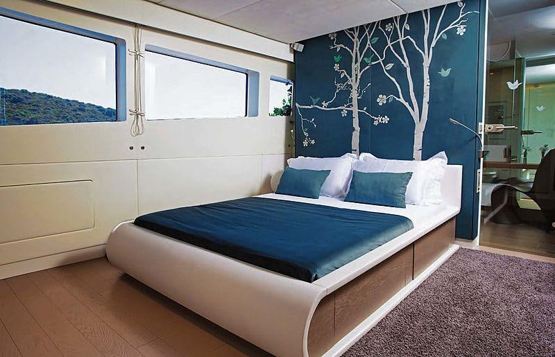 a bed in a room aboard JOY ME Yacht for Charter