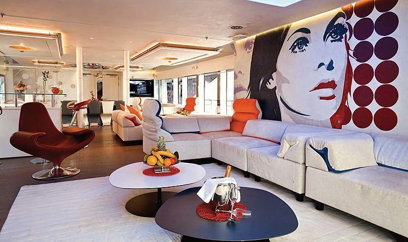 a living room with a large balloon aboard JOY ME Yacht for Charter