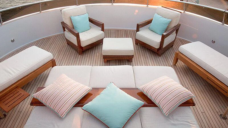 a white couch with pillows on it aboard ASPEN ALTERNATIVE Yacht for Charter