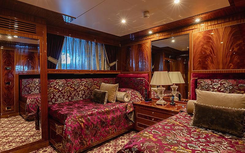 a couple of beds in a room aboard KADIMO'S Yacht for Charter