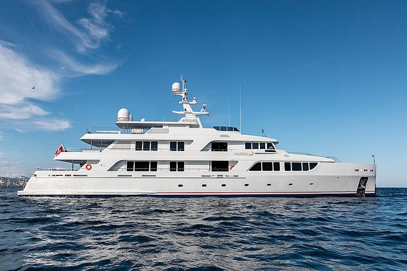 a white yacht in the water aboard KADIMO'S Yacht for Charter