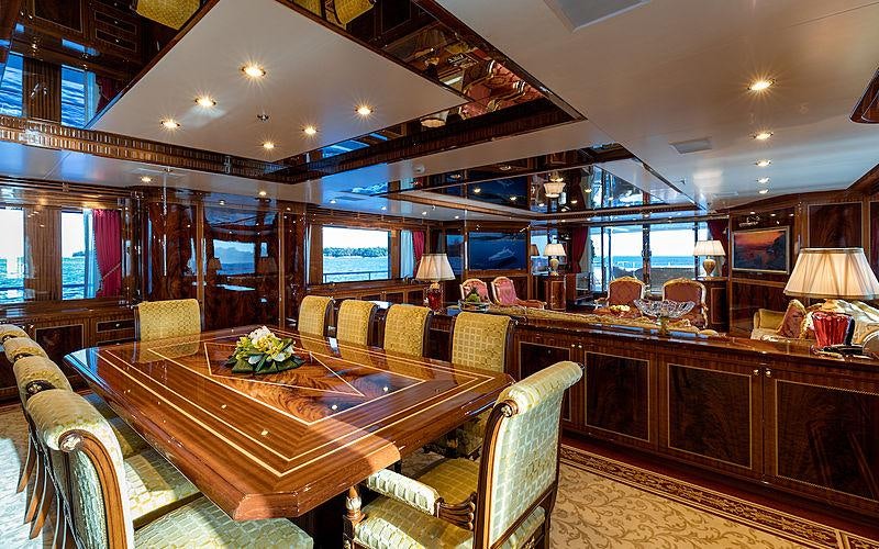 a large dining room with a large table and chairs aboard KADIMO'S Yacht for Charter