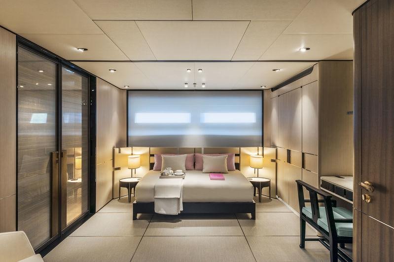 a room with a bed and a tv aboard ENDEAVOUR 2 Yacht for Charter