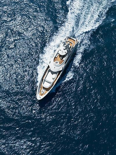 a silver guitar on a blue surface aboard ARKADIA Yacht for Charter