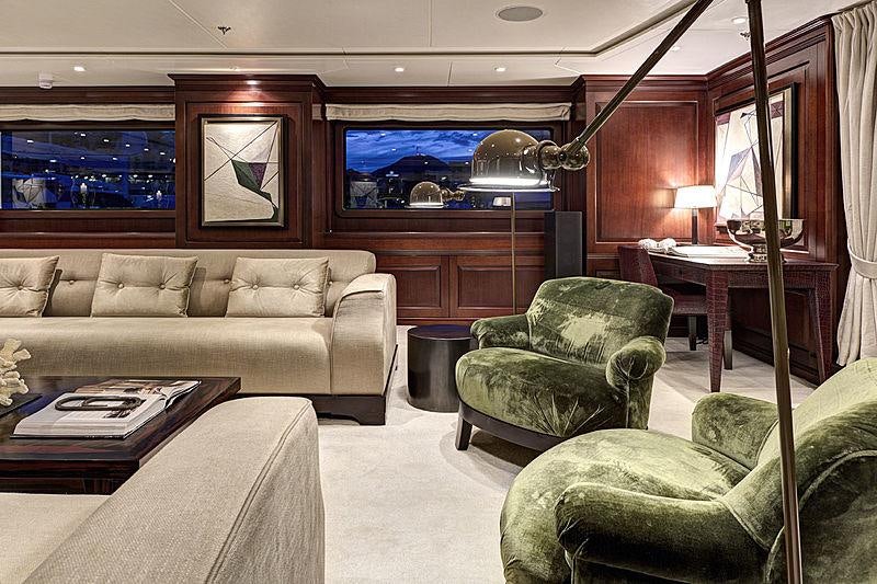a living room with a couch and a television aboard AZTECA Yacht for Charter
