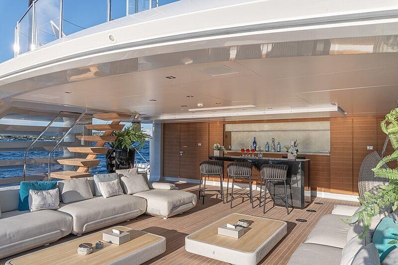 a living room with a couch and a table aboard LEL Yacht for Charter